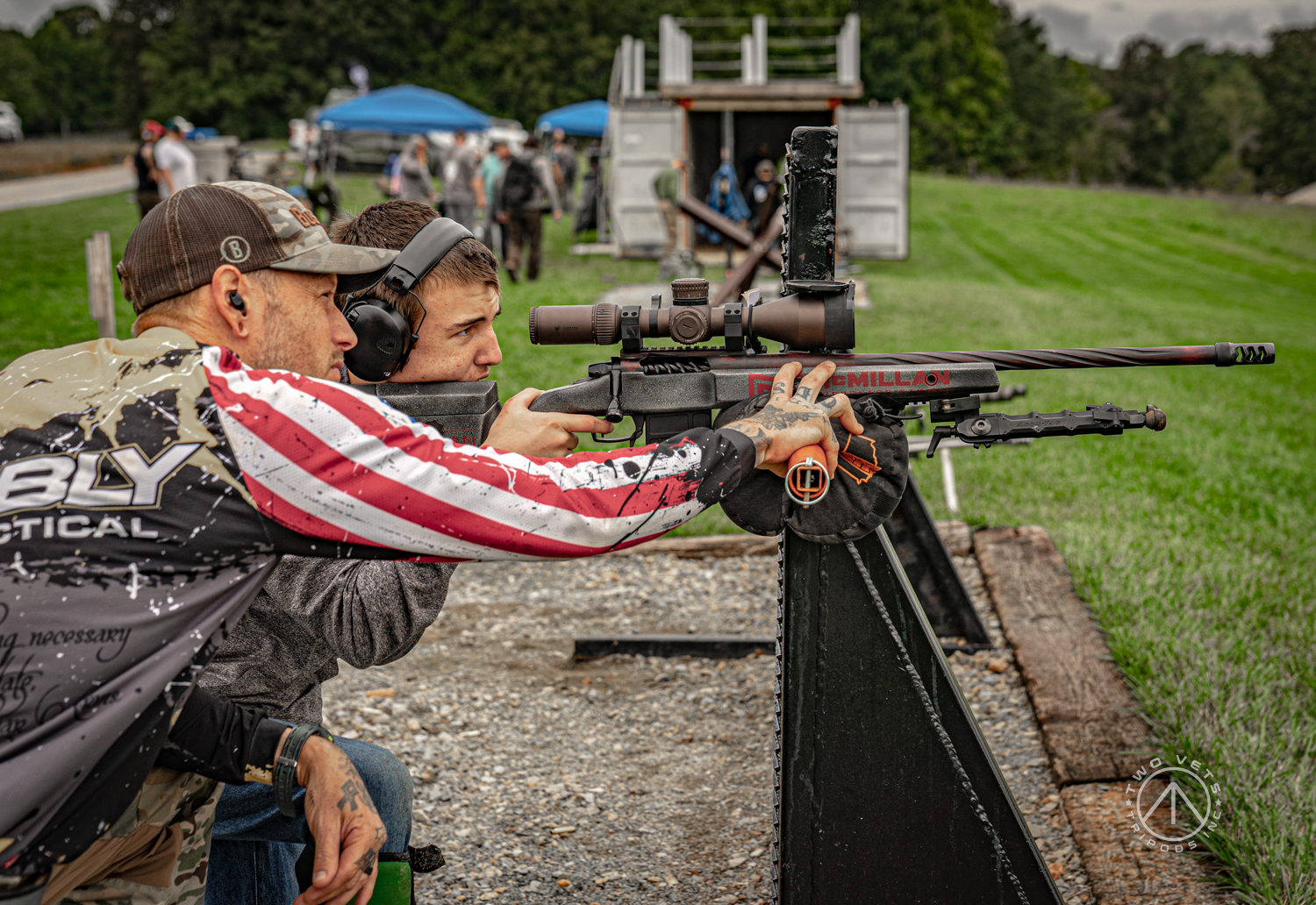 Coach spotting a shooter on the firing line